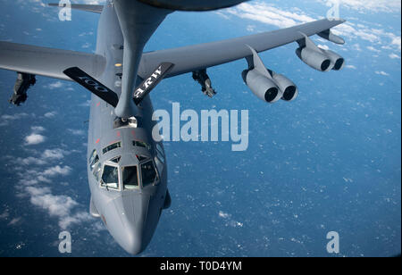 A U.S. Air Force B-52 Stratofortress receives fuel from a KC-135 Stratotanker from the 100th Air Refueling Wing, RAF Mildenhall, England, above the U.K. coast, March 15, 2019. The U.S. routinely and visibly demonstrates commitment to allies and partners through the global employment of military forces. (U.S. Air Force photo by Tech. Sgt. Emerson Nuñez) Stock Photo