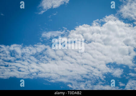 A deep blue sky with continuous white clouds Stock Photo