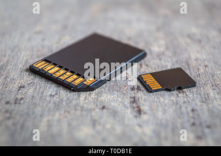 A SD and a Micro SD Memory Card on a table close up Stock Photo
