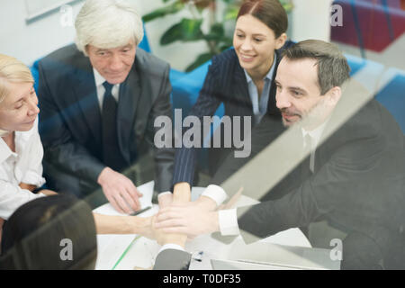 Business Team Huddling Stock Photo