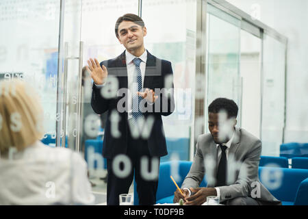 Young Businessman Giving Presentation Stock Photo