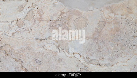 Full frame texture background of a weathered and abstract light brown stone slab. Stock Photo