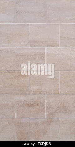 Full frame background of a new, modern and clean wall or building exterior made of light brown slabs. Stock Photo