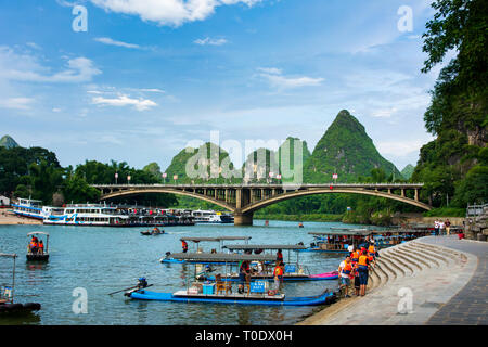 Yangshuo, China - July 27, 2018: Tourist bamboo rafts on Li river in Yangshuo near Guilin a famous travel city in southern China Stock Photo