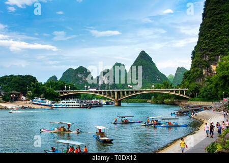 Yangshuo, China - July 27, 2018: Tourist bamboo rafts on Li river in Yangshuo near Guilin a famous travel city in southern China Stock Photo