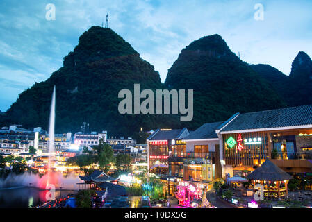 Yangshuo, China - July 27, 2018: Yangshuo scenic city park a main entertainment and leisure sightseeing spot at dusk Stock Photo