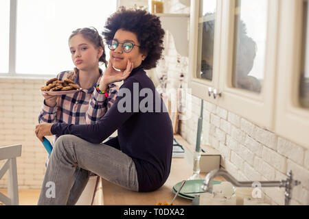 Joyful international teenagers looking straight at camera Stock Photo