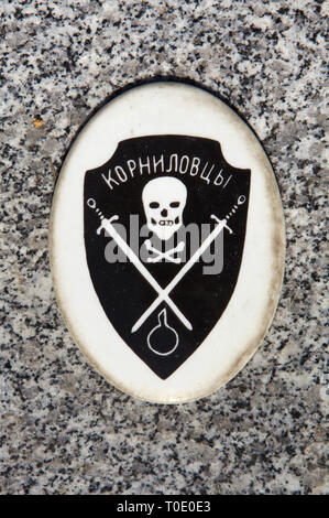 Insignia of the Kornilov's Shock Regiment of the Volunteer Army (White Army) during the Russian Civil War depicted on one of the graves of Russian emigrants at the Russian Cemetery in Sainte-Geneviève-des-Bois (Cimetière russe de Sainte-Geneviève-des-Bois) near Paris, France. Stock Photo