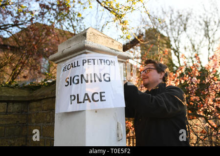 A sign is placed outside Bedford Hall in Thorney, Peterborough, where voters are being given the opportunity to sign a petition to force a by-election following the conviction of local MP Fiona Onsanya for lying about a speeding offence. Stock Photo