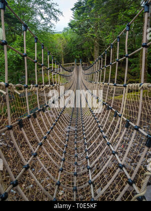 walking through Kells Gardens and rope bridge Stock Photo