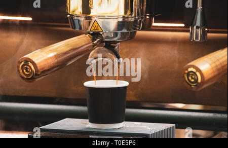 espresso shot from coffee machine in coffee shop,Coffee maker in coffee shop Stock Photo