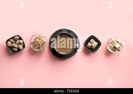 Concept of coffee, cacao beans and sugar on pink background. Top view. Stock Photo