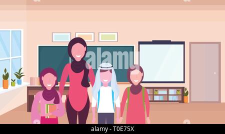 muslim arabian teacher with arab schoolboy solving math problem on ...