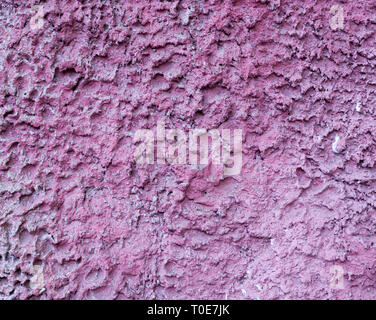 pink painted relief wall. background, texture. Stock Photo