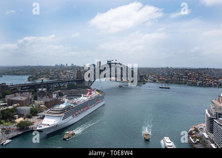 Viewed from above, the cruise ship Carnival Spirit moored at Circular Quay in front of the Sydney Harbour (Harbor) Bridge Stock Photo