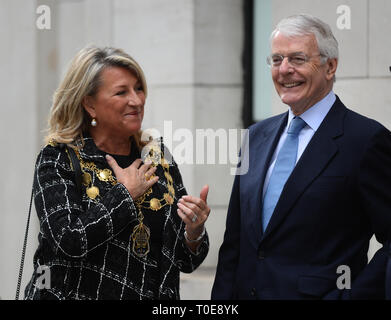 Councillor Lindsey Hall, Lord Mayor of Westminster, and former prime minister John Major await the arrival of the Queen Elizabeth II and the Duchess of Cambridge at King's College London, where they will open Bush House, the latest education and learning facilities on the Strand Campus. Stock Photo