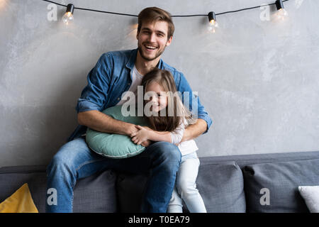 Father with his daughter spending time at home. Stock Photo