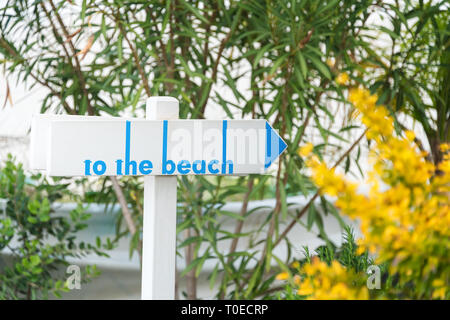 Beach sign on a wooden table. Beach access path Stock Photo