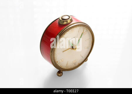 Vintage alarm clock, isolated on white background, close-up Stock Photo