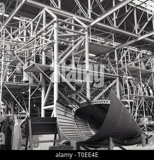 1950s, aircraft construction inside a large hangar, England, UK, showing the complicated platform structure necessary to build planes, Stock Photo