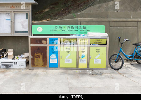 Litter and recycling bins on the small Hong Kong island of Peng Chau Stock Photo