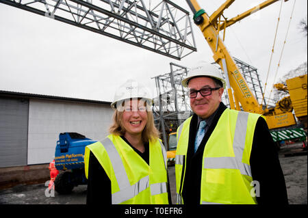 FREE FIRST USE  A massive truss is installed at Tollcross International Swimming Centre to prepare the venue for the 2014 Commonwealth Games.  L-R Sho Stock Photo