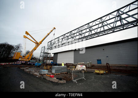 FREE FIRST USE  A massive truss is installed at Tollcross International Swimming Centre to prepare the venue for the 2014 Commonwealth Games.  Lenny W Stock Photo