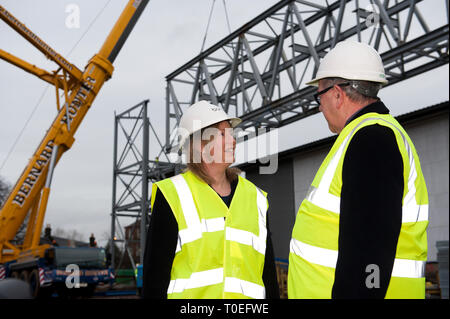 FREE FIRST USE  A massive truss is installed at Tollcross International Swimming Centre to prepare the venue for the 2014 Commonwealth Games.  L-R Sho Stock Photo