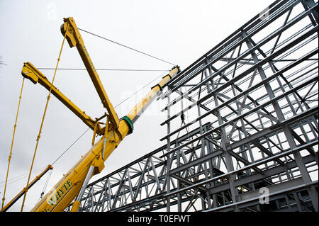 FREE FIRST USE  A massive truss is installed at Tollcross International Swimming Centre to prepare the venue for the 2014 Commonwealth Games.  Lenny W Stock Photo