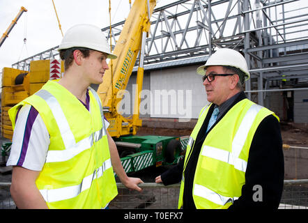 FREE FIRST USE  A massive truss is installed at Tollcross International Swimming Centre to prepare the venue for the 2014 Commonwealth Games.  L-R swi Stock Photo