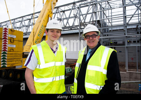 FREE FIRST USE  A massive truss is installed at Tollcross International Swimming Centre to prepare the venue for the 2014 Commonwealth Games.  L-R swi Stock Photo