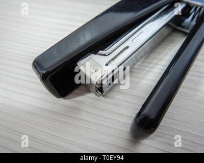 Black stapler close up diagonal shot Stock Photo
