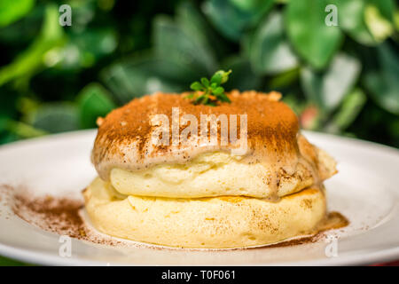 Tiramisu Souffle Pancake with mascarpone cheese, coffee and coco powder Stock Photo