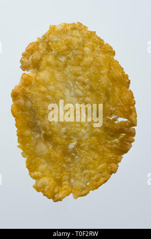 Macro image of flaked corn isolated against white background Stock Photo