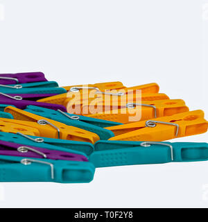 Clothes Pegs. Isolated. Colourful  plastic clothes pegs on a white background. Stock Image Stock Photo