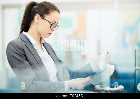 Businesswoman Reading Document Stock Photo