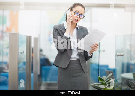 Female Boss in Speaking by Phone Stock Photo