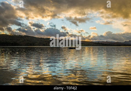 Looking across Windermere Lake from Miller Ground in the Lake District National Park, Cumbria. The reflections from the clouds are beautiful Stock Photo