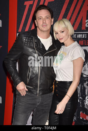 HOLLYWOOD, CA - MARCH 18: Donovan Leitch (L) and Libby Mintz arrive at the Premiere Of Netflix's 'The Dirt' at ArcLight Hollywood on March 18, 2019 in Hollywood, California. Stock Photo