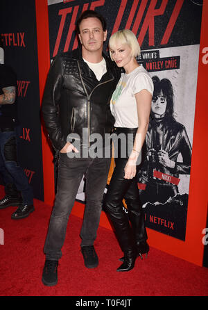 HOLLYWOOD, CA - MARCH 18: Donovan Leitch (L) and Libby Mintz arrive at the Premiere Of Netflix's 'The Dirt' at ArcLight Hollywood on March 18, 2019 in Hollywood, California. Stock Photo