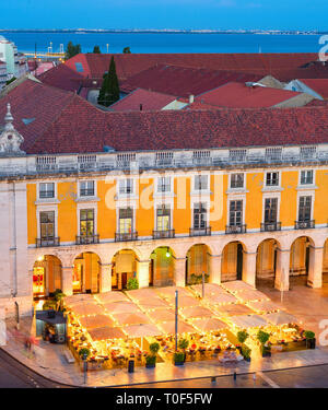 Aerial evening view of illuminated restaurant at Commerce Square of Lisbon Old Town, Portugal Stock Photo