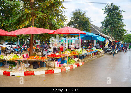 PAI, THAILAND - JANUARY 10, 2017: People buying fresh grocery at Thailand food grocery market in Pai city street Stock Photo