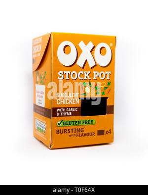 Orange Oxo stock pot box of succulent chicken on an isolated white background Stock Photo