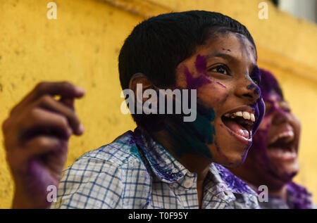 Mumbai, India. 19th Mar, 2019. Children with coloured powder on their faces are seen during the Holi festival celebrations at a special school in Mumbai, India, March 19, 2019. A celebrating event of Holi festival was held on Tuesday for the physically and mentally disabled Indian children at a special school in Mumbai. The Hindu festival of Holi, or the Festival of Colours, heralds the arrival of spring. Credit: Stringer/Xinhua/Alamy Live News Stock Photo