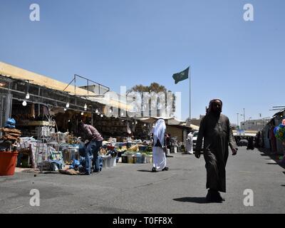 Abha, Saudi Arabia. 19th Mar, 2019. Photo taken on March 19, 2019 shows a view of the Thulatha Market in Abha, Asir Province, Saudi Arabia. Thulatha, a famous traditional market in the city of Abha, sells fresh produce and local handicrafts, such as honey, dates, gold and silver Bedouin jewelry, women's embroidered dresses, and locally-made daggers. The Thulatha Market used to only operate on Tuesdays, and now is open seven days a week, attracting lots of shoppers and visitors. Credit: Tu Yifan/Xinhua/Alamy Live News Stock Photo
