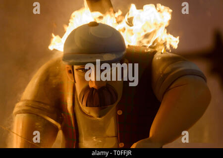 Valencia, Spain. 19th March, 2019. The Valencians fire their piestats by burning the monument on the night of San José. The firemen are in charge of controlling the flames. Carcaixent, Valencia, Spain. Credit: Salva Garrigues/Alamy Live News Stock Photo