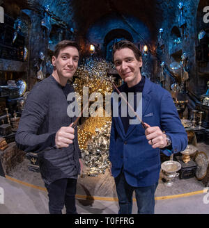James Phelps (L) and Oliver Phelps in the Lestrange Vault set at the original Gringotts Wizarding Bank at Warner Bros. Studio Tour London in Watford. Warner Bros. Studio Tour London – The Making of Harry Potter unveils its biggest expansion to date, the original Gringotts Wizarding Bank will be open to the public from Saturday 6th April. Stock Photo