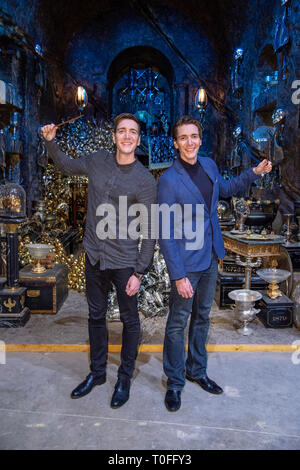 James Phelps (L) and Oliver Phelps in the Lestrange Vault set at the original Gringotts Wizarding Bank at Warner Bros. Studio Tour London in Watford. Warner Bros. Studio Tour London – The Making of Harry Potter unveils its biggest expansion to date, the original Gringotts Wizarding Bank will be open to the public from Saturday 6th April. Stock Photo