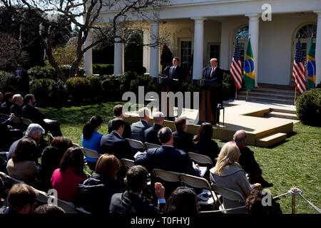 Washington, DC, USA. 19th Mar, 2019. U.S. President Donald Trump (R) attends a joint press conference with his Brazilian counterpart Jair Bolsonaro at the Rose Garden of the White House in Washington, DC, the United States, on March 19, 2019. U.S. President Donald Trump on Tuesday indicated that he may support Brazil to join the North Atlantic Treaty Organization (NATO) and the Organization for Economic Co-operation and Development (OECD), as the two nations expected to further their economic cooperation. Credit: Ting Shen/Xinhua/Alamy Live News Stock Photo
