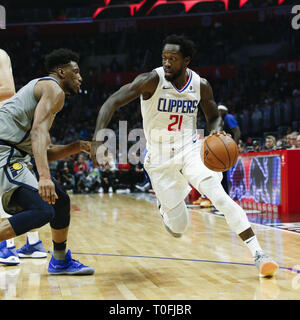 Los Angeles, California, USA. 19th Mar, 2019. Los Angeles Clippers' Patrick Beverley (21) drives against Indiana Pacers' Thaddeus Young (21) during an NBA basketball game between Los Angeles Clippers and Indiana Pacers, Tuesday, March 19, 2019, in Los Angeles. Credit: Ringo Chiu/ZUMA Wire/Alamy Live News Stock Photo